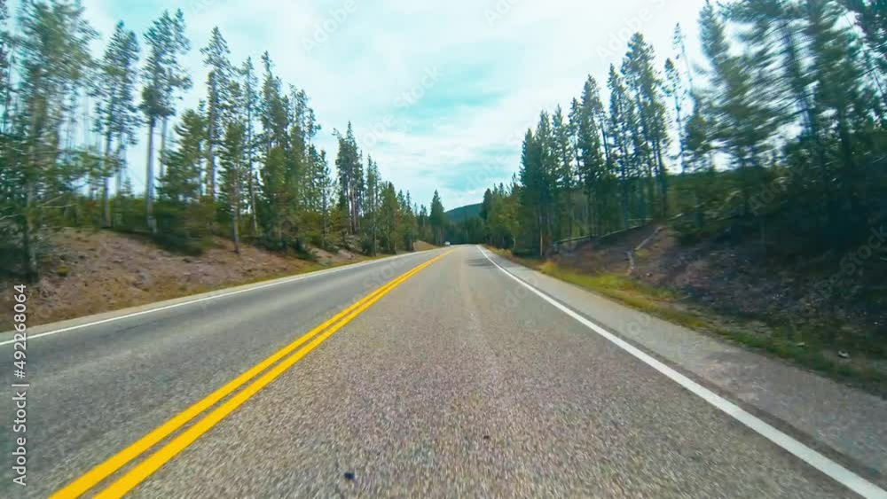 Timelapse hyperlapse of driving around forests and mountains, in Yellowstone national park. Timelapse hyperlapse of driving around forests and mountains, in Yellowstone national park.