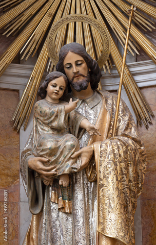 VALENCIA, SPAIN - FEBRUAR 14, 2022: The carved polychrome statue of St. Joseph in the Cathedral - Basilica of the Assumption of Our Lady José Ponsoda (1882-1963). photo