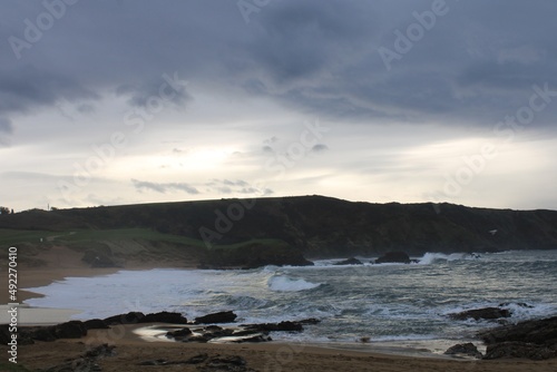 Beach with waves at sunset