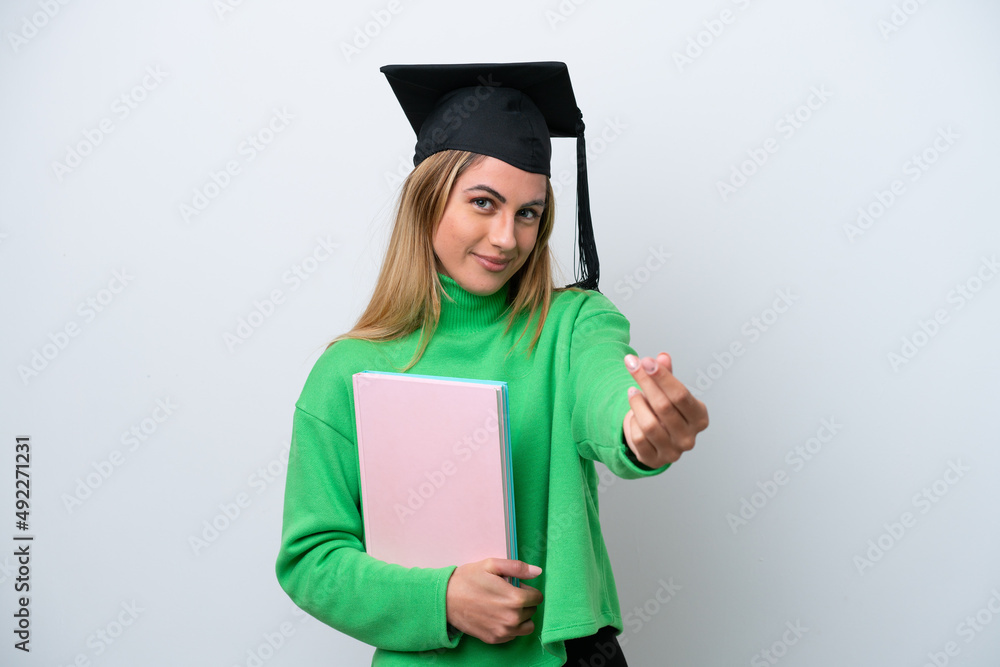 Young university graduate woman isolated on white background making money gesture Young university graduate woman isolated on white background making money gesture