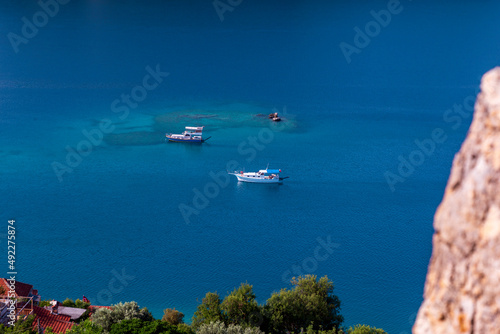 The village of Kalekoy in the centre near Kekova island in the Antalya Province of Turkey © Birol