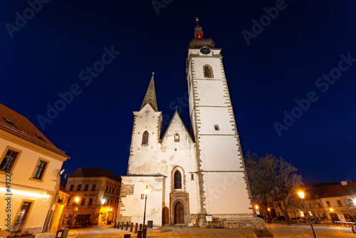 Gothic church of the Nativity of the Blessed Virgin Mary and clock tower. Pisek - town in South Czechia.