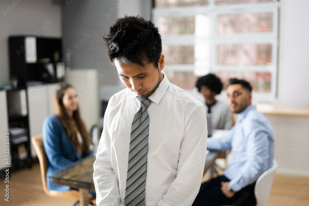 Stressed Asian Colleague And Other Workers Bullying Stressed Asian Colleague And Other Workers Bullying