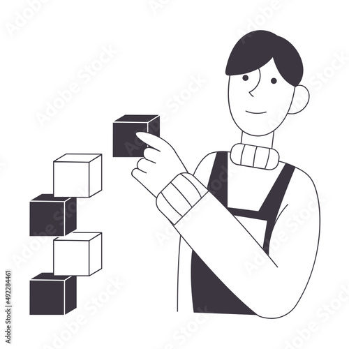man assembles a tower of cubes