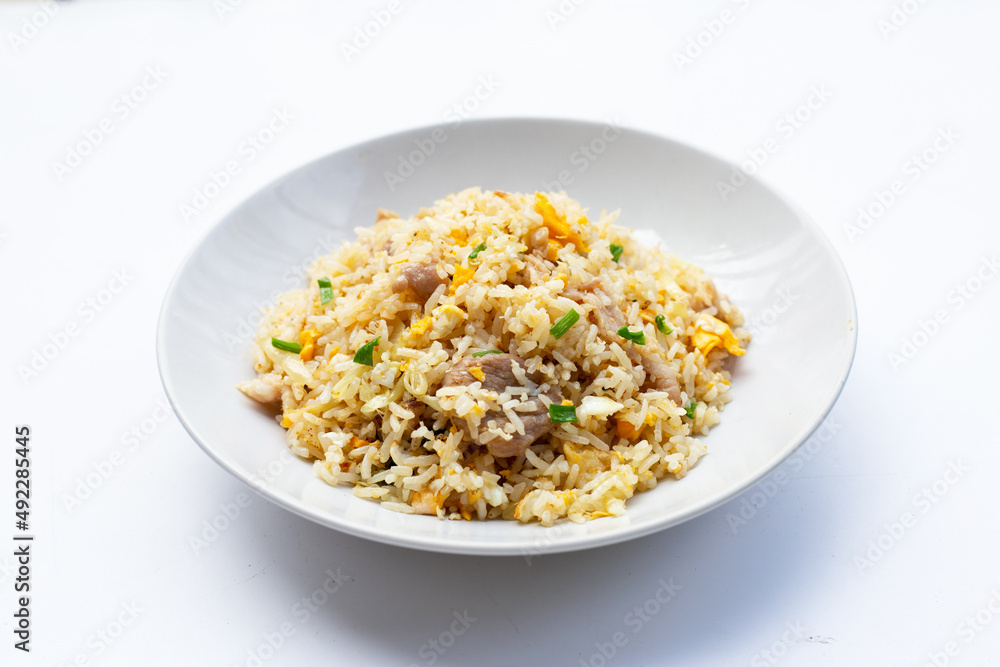 Fried rice in white plate on white background. Fried rice in white plate on white background.
