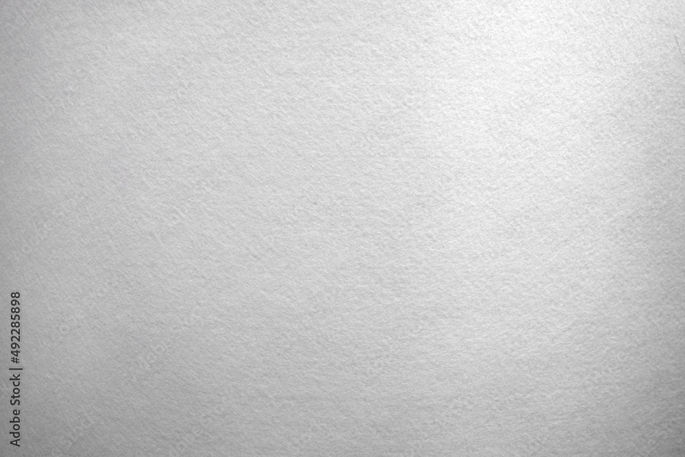 White background made of soft felt fabric.Rag light background with fine white hairs. White background made of soft felt fabric.Rag light background with fine white hairs.
