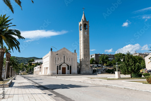 church in Ploce in Croatia, center of the city Ploce, promenade in Ploce, summer cityscape, blue and cloudy sky