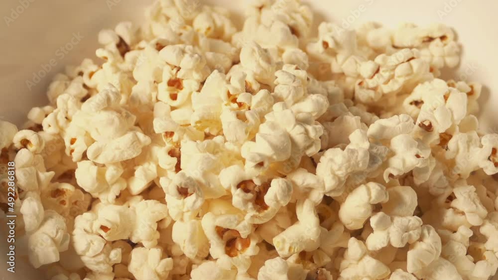 Popcorn Fills Up Bowl Closeup Popcorn Fills Up Bowl Closeup