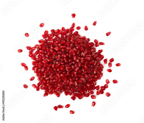 Pomegranate seeds on white