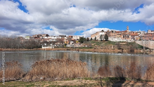 Views of the Duero River with a bridge as it passes through Tordesillas, in Valladolid, Spain. Europe. Horizontal photography.