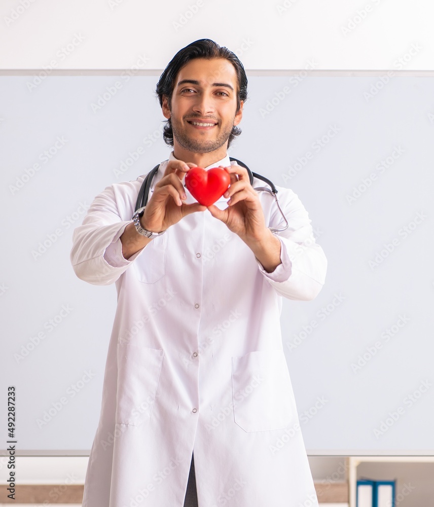 The young doctor in front of whiteboard