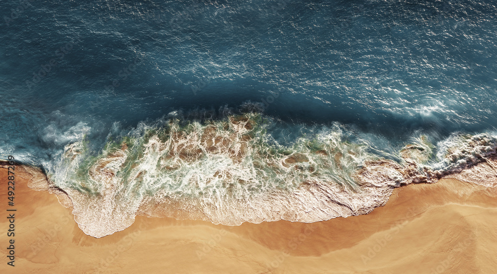 Panoramic view of the sandy beach. Sandy beach, panorama. The sea wave rolls on the shore. Sea coast view from the air. Aerial photography of the sea wave. The ocean and beach. Copy space