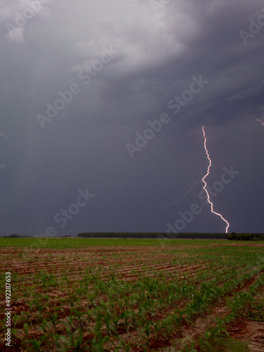Lightning under the farm during a storm.