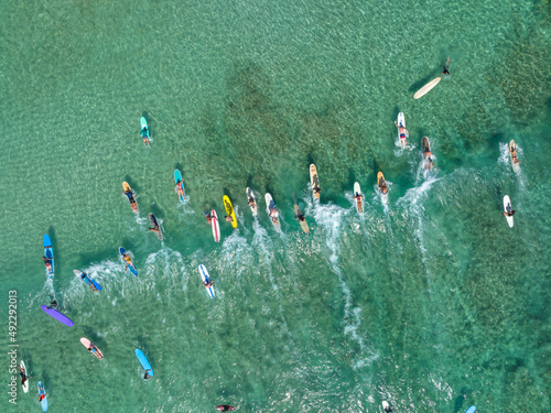 Surfboards floating in Waikiki beach water