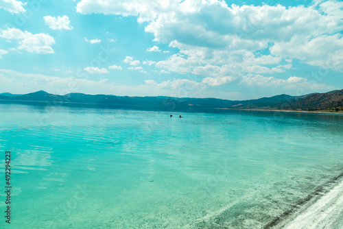 Fototapeta Naklejka Na Ścianę i Meble -  Turquoise lake Salda Turkey. White mineral rich beach. Salda lake with white sand and green water. Burdur Turkey
