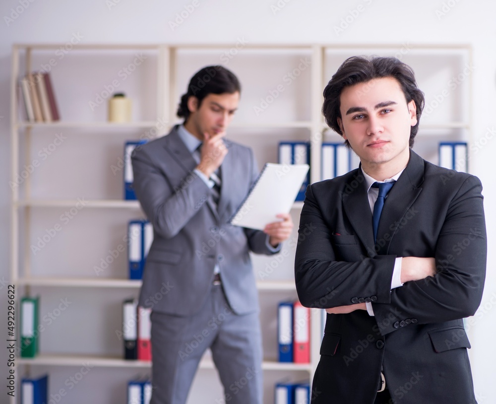 Two young businessmen meeting in the office Two young businessmen meeting in the office
