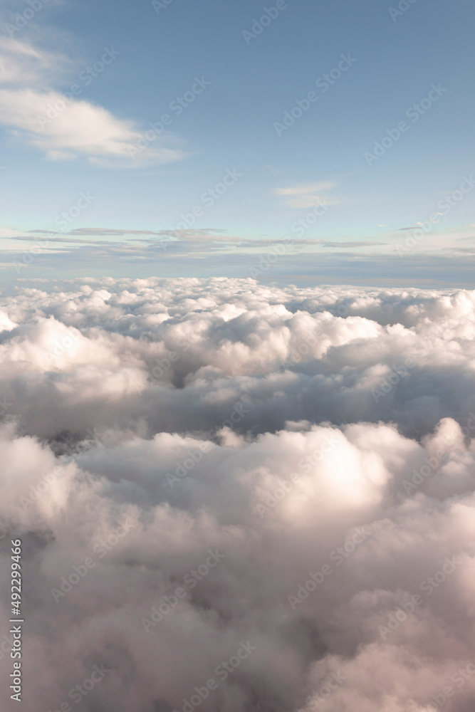 View across fluffy clouds and a blue sky