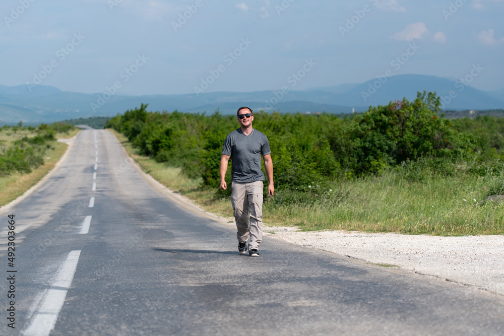 Portrait of Muscular Man Standing Outdoors at Highway Portrait of Muscular Man Standing Outdoors at Highway