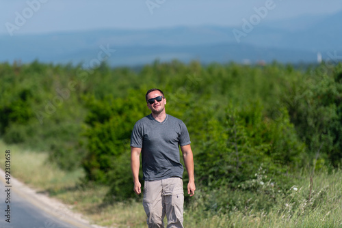 Portrait of Muscular Man Standing Outdoors at Highway © Jale Ibrak