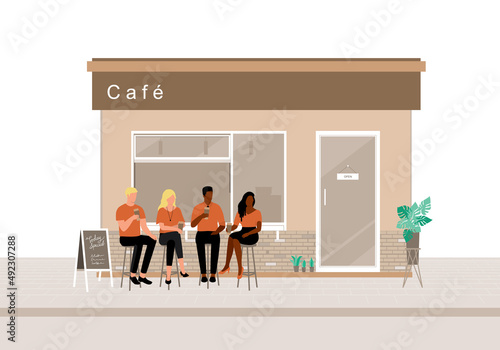 Multi-Ethnic Young Adult Sitting On A Stool While Drinking Coffee At The Modern Outdoor Cafe.