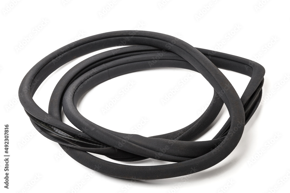 Rolled up black rubber sealant for elements of the car body, doors or trunk, for noise insulation, thermal and sound, preventing heat loss in the car interior. Sealing gasket for repair in a workshop Rolled up black rubber sealant for elements of the car body, doors or trunk, for noise insulation, thermal and sound, preventing heat loss in the car interior. Sealing gasket for repair in a workshop