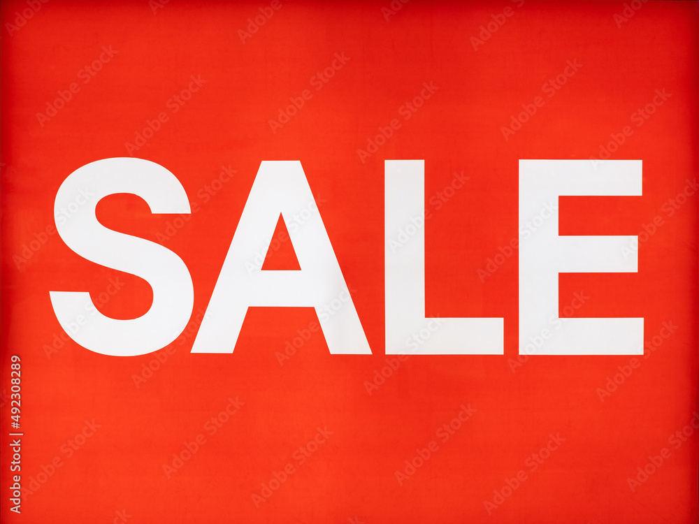 big white sale word or text on light sign in shop behind glass window or wall and red background at shopping mall or department store for advertising on signboard and business marketing big white sale word or text on light sign in shop behind glass window or wall and red background at shopping mall or department store for advertising on signboard and business marketing
