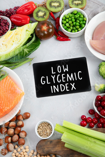 Foods with low glycemic index on gray background. photo