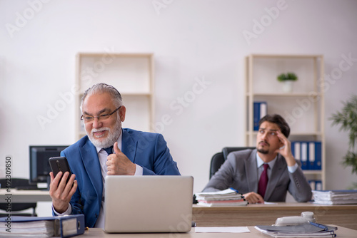 Two male colleagues working in the office