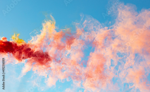 Red smoke on a blue background.
