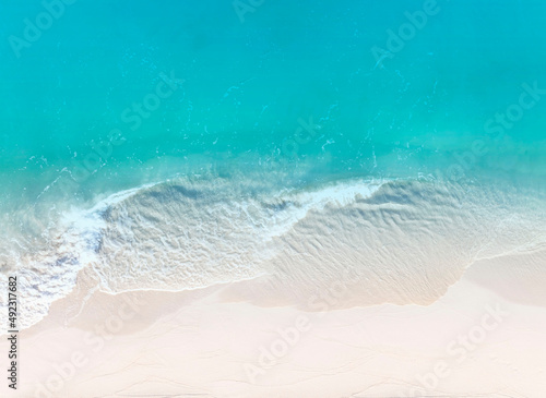 Aerial view beautiful of summer tropical with sea waves from drone. Stock image of blue color of ocean water, sea surface. Top view on turquoise waves