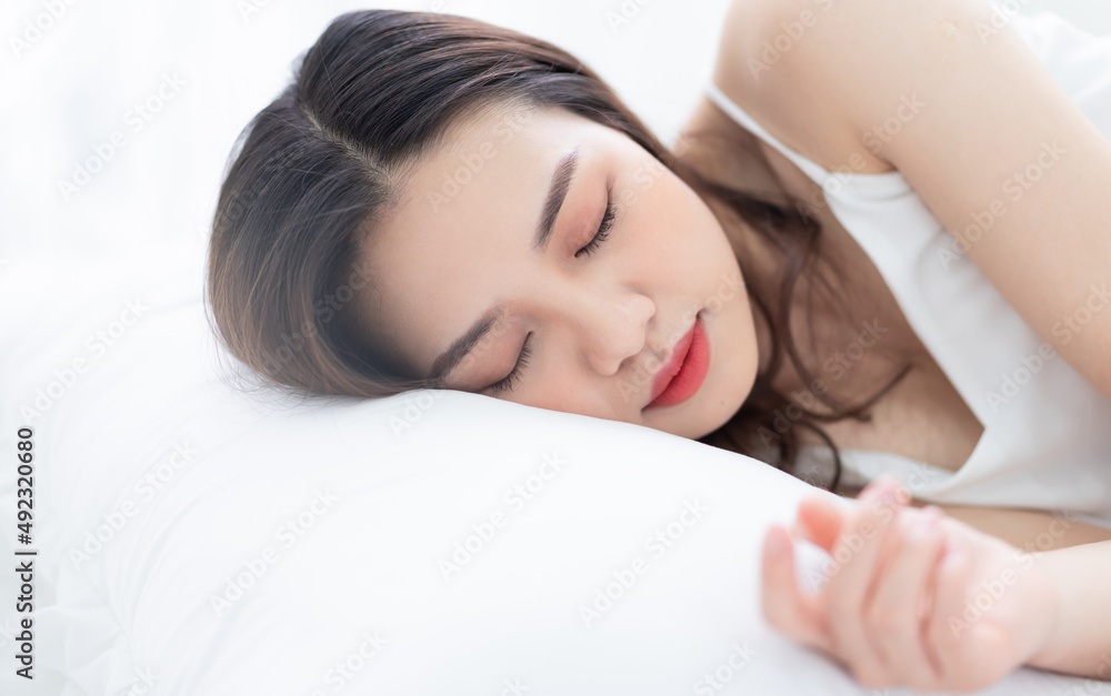 Image of young Asian woman in bed Image of young Asian woman in bed