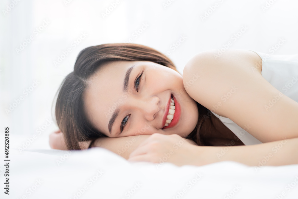Obraz premium Image of young Asian woman in bed