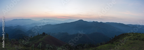 Beautiful nature of sunrise and mountains complex with morning mist atmosphere at Tak  Thailand.