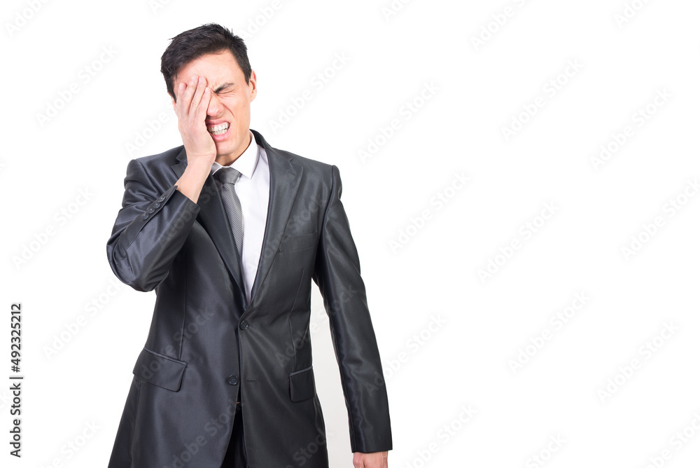 Weary man having strong headache rubbing face and closing eyes Weary man having strong headache rubbing face and closing eyes