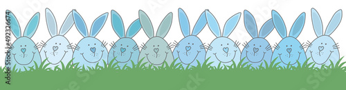 Reihe von blauen Osterhasen verstecken sich auf der Wiese