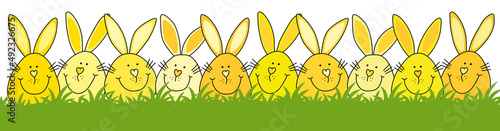 Gelbe Osterhasen im grünen Gras, fröhlicher Cartoon von Hand gezeichnet