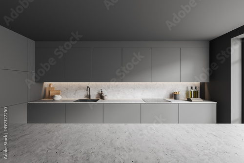 Grey countertop on background of kitchen interior with shelves. Mockup