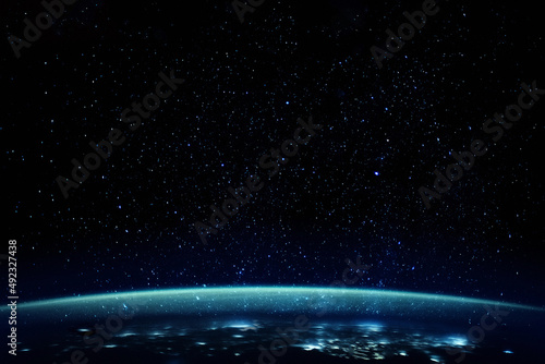 Stars over planet with blue atmosphere