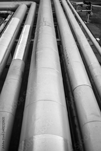 Detail of an Oil and Gas Industry thermal insulate steel pipes. They're used for hydrocarbons storage and transportation, inside O&G treatment plants.