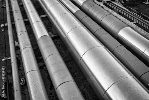 Detail of an Oil and Gas Industry thermal insulate steel pipes. They're used for hydrocarbons storage and transportation, inside O&G treatment plants.