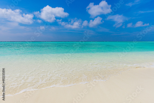 Blue sea wave  ocean lagoon  white foam  sand beach  turquoise ocean water close up  summer holidays. Tropical island vacation backdrop  tourist travel banner design template  copy space
