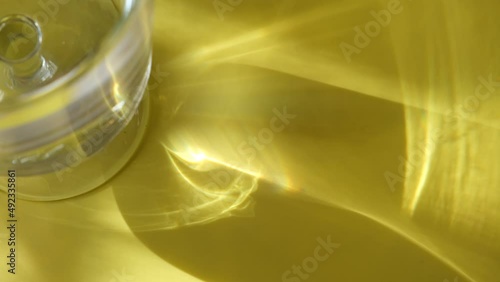 Blurred glass vase with water, reflection, shadow, sunlight, minimal natural luxury, copy space