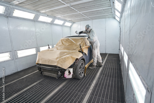 Canvas Print Process of male work in workshop during painting