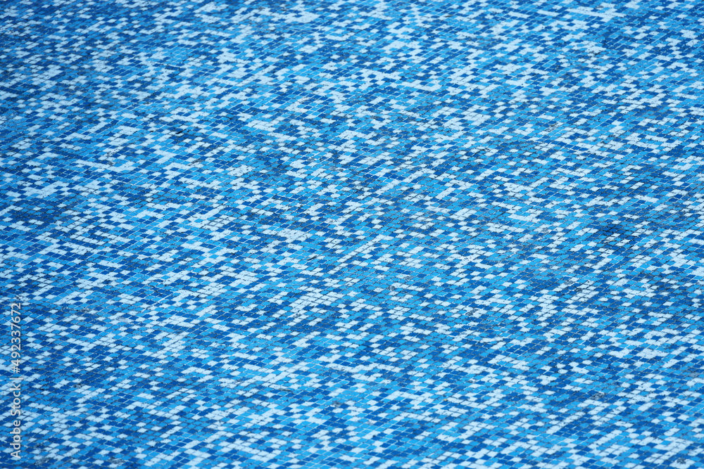 Blue mosaic old dirty tiles for bathroom or swimming pool. Ceramic square decorative tile. Abstract texture background.