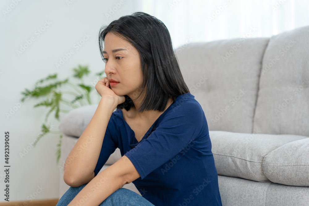 Depression and mental illness. Asian woman disappointed, sad after receiving bad news. Stressed girl confused with unhappy problems, arguing with boyfriend, cry and worry about unexpected pregnancy. Depression and mental illness. Asian woman disappointed, sad after receiving bad news. Stressed girl confused with unhappy problems, arguing with boyfriend, cry and worry about unexpected pregnancy.