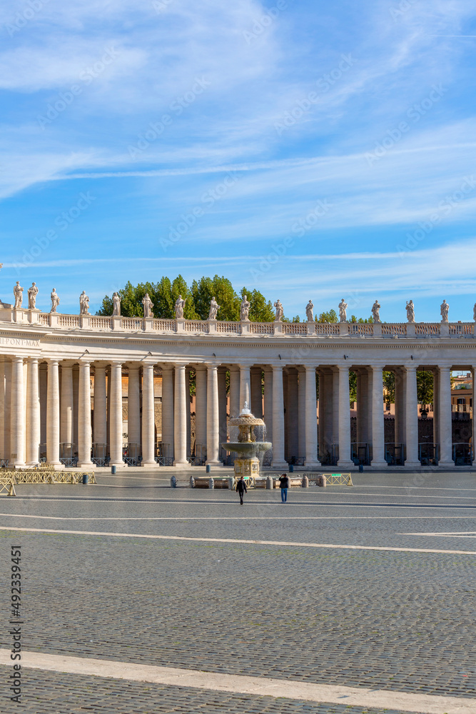 Colonnade and fountain on St.Peter's Square in front of Saint Peter's Basilica. Deserted square due to the Covid-19 coronovirus pandemic, Vatican, Rome, Italy Colonnade and fountain on St.Peter's Square in front of Saint Peter's Basilica. Deserted square due to the Covid-19 coronovirus pandemic, Vatican, Rome, Italy