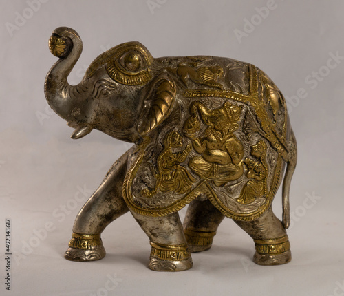 Photography Figurine of an Indian elephant made of bronze on a white background