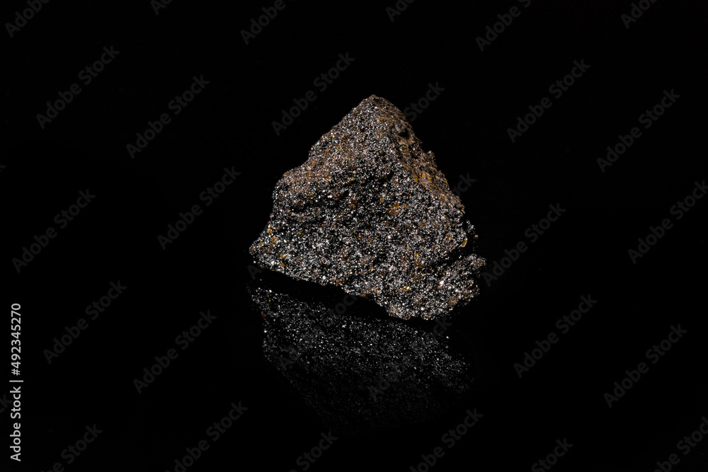 Macro Close up image of raw material Platinum and Chrome Ore rock isolated Macro Close up image of raw material Platinum and Chrome Ore rock isolated