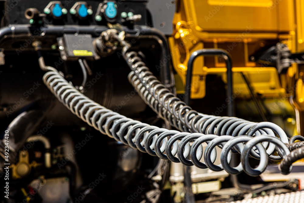 Fototapeta premium spiral hose pipes on the rear of a semi truck tractor