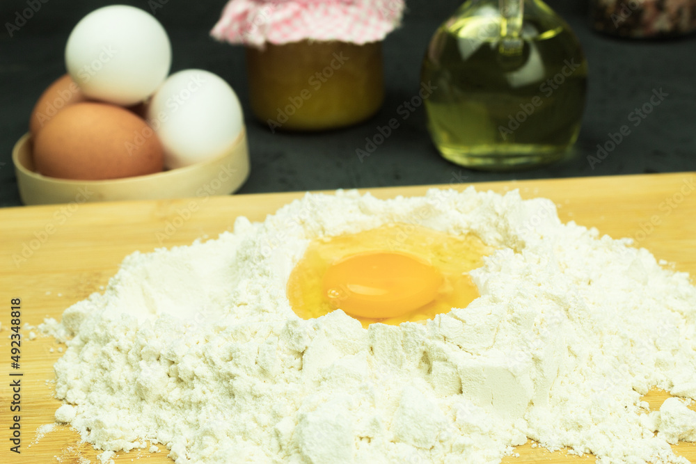 Fresh and raw chicken egg in flour Fresh and raw chicken egg in flour